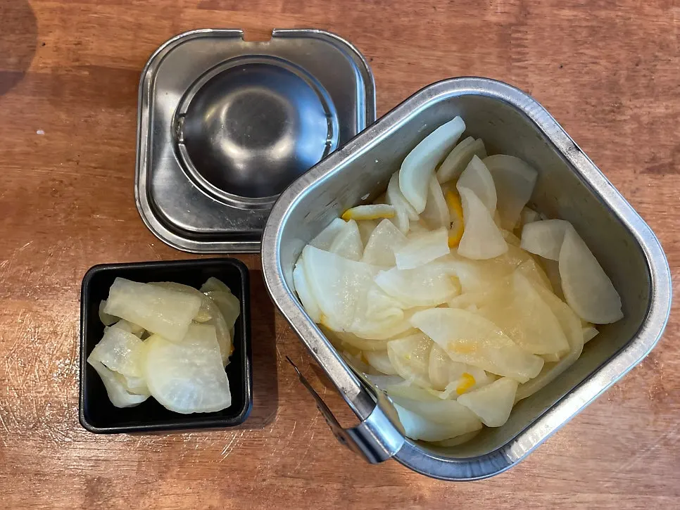 Utensils, water and pepper set on the table