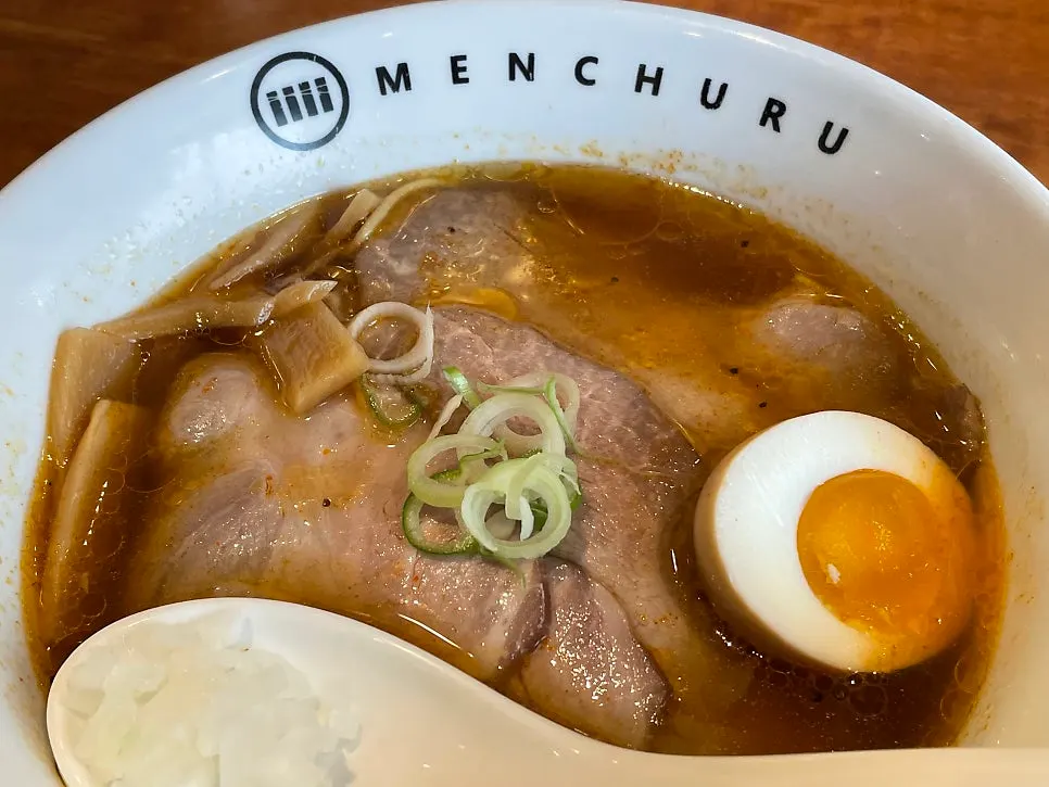 Broth and toppings of the regular shoyu ramen