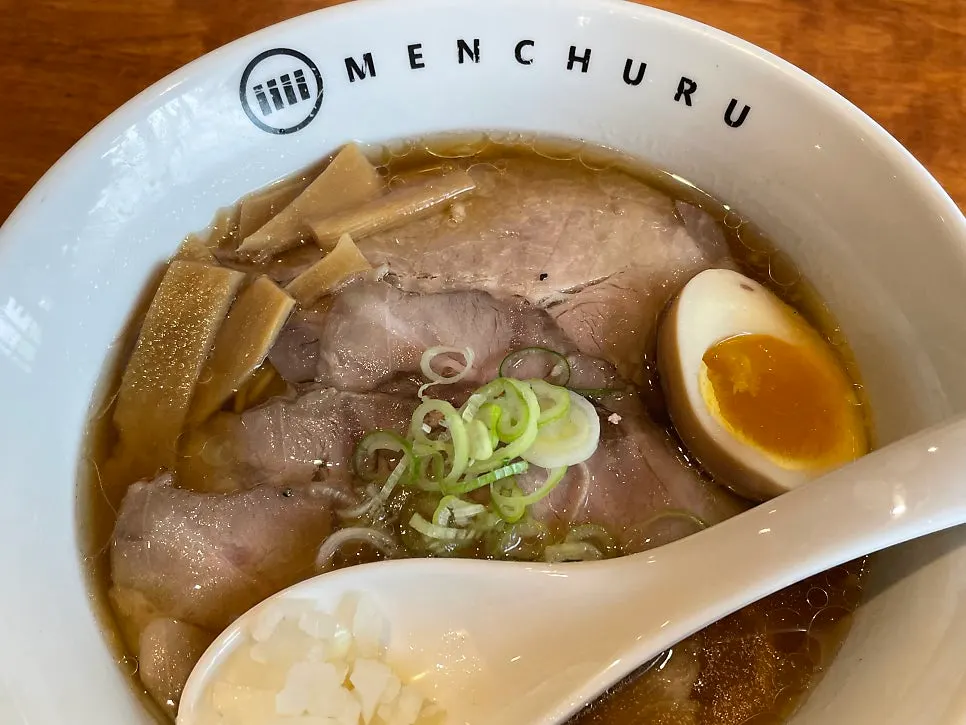 Close-up of ramen loaded with meat toppings