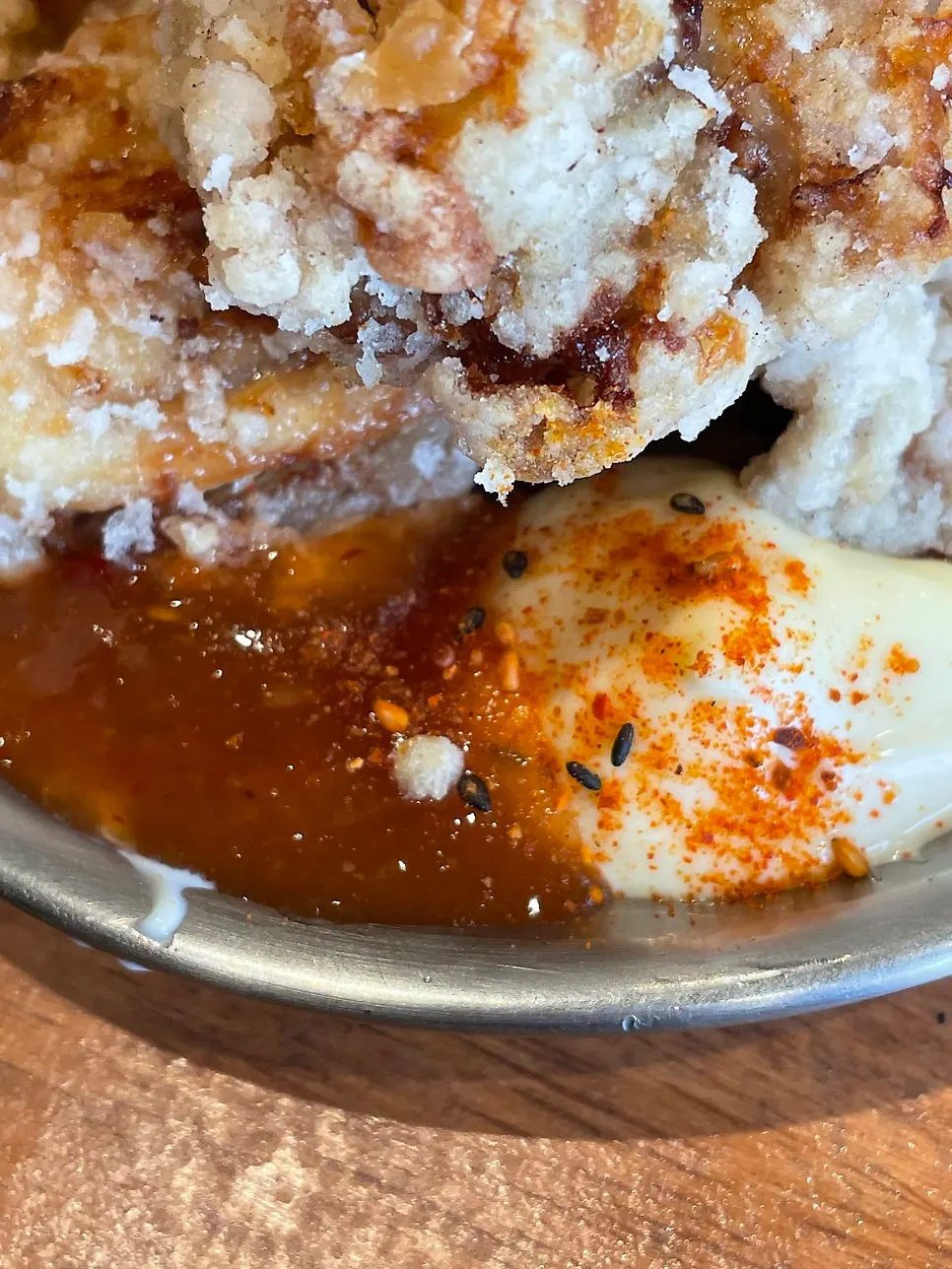 A piece of karaage with lemon squeezed over it