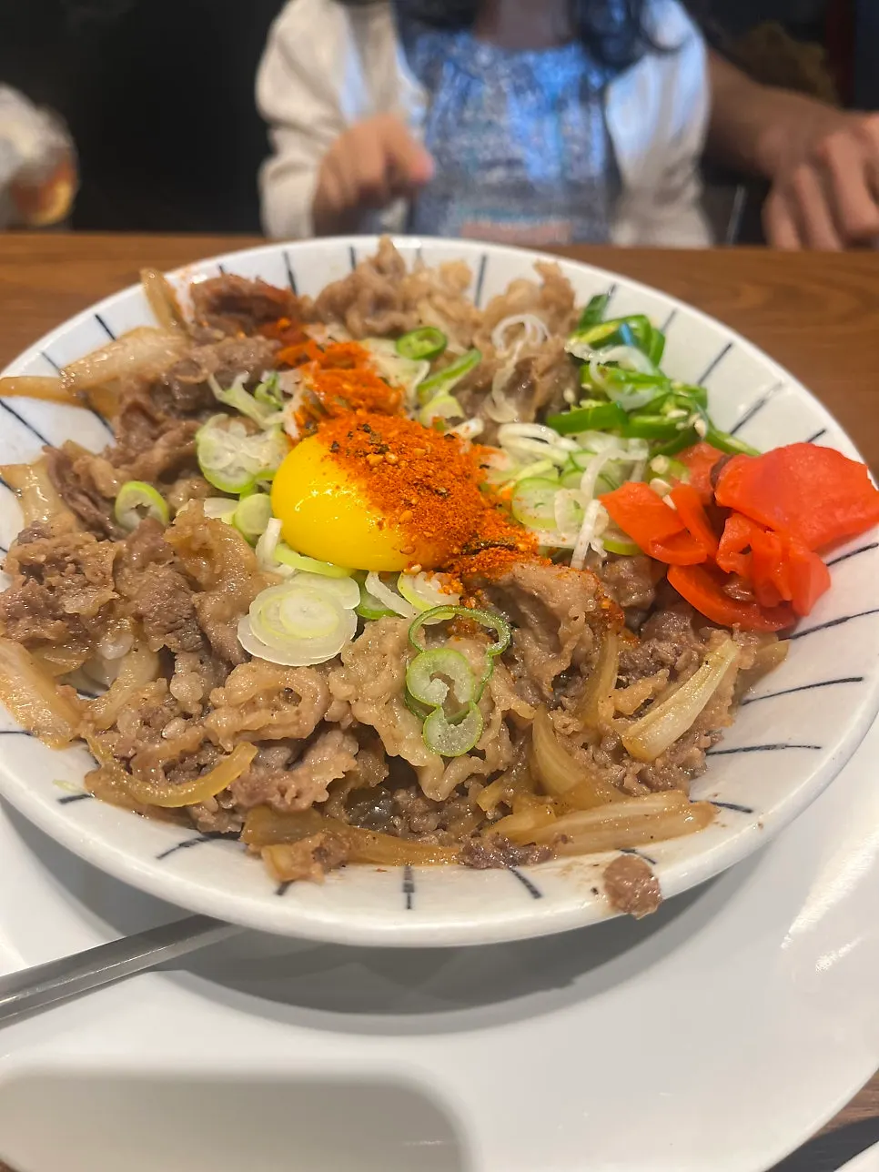 Gyudon rice bowl topped with beef belly