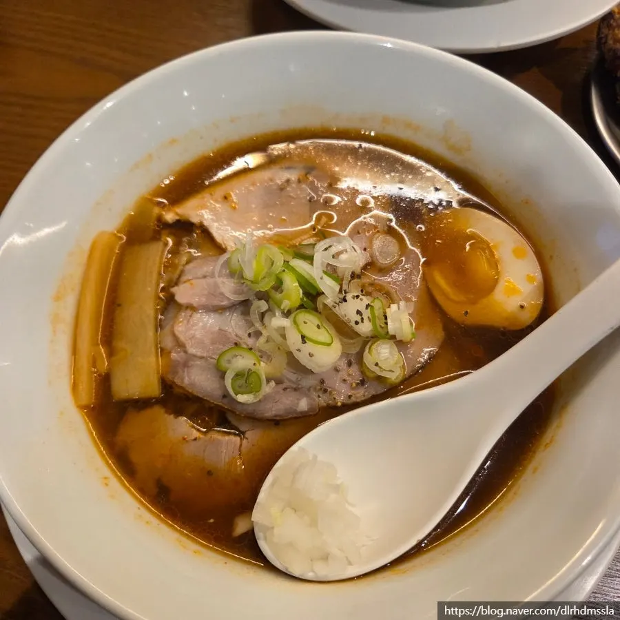 Shoyu ramen topped with half a soft-boiled egg