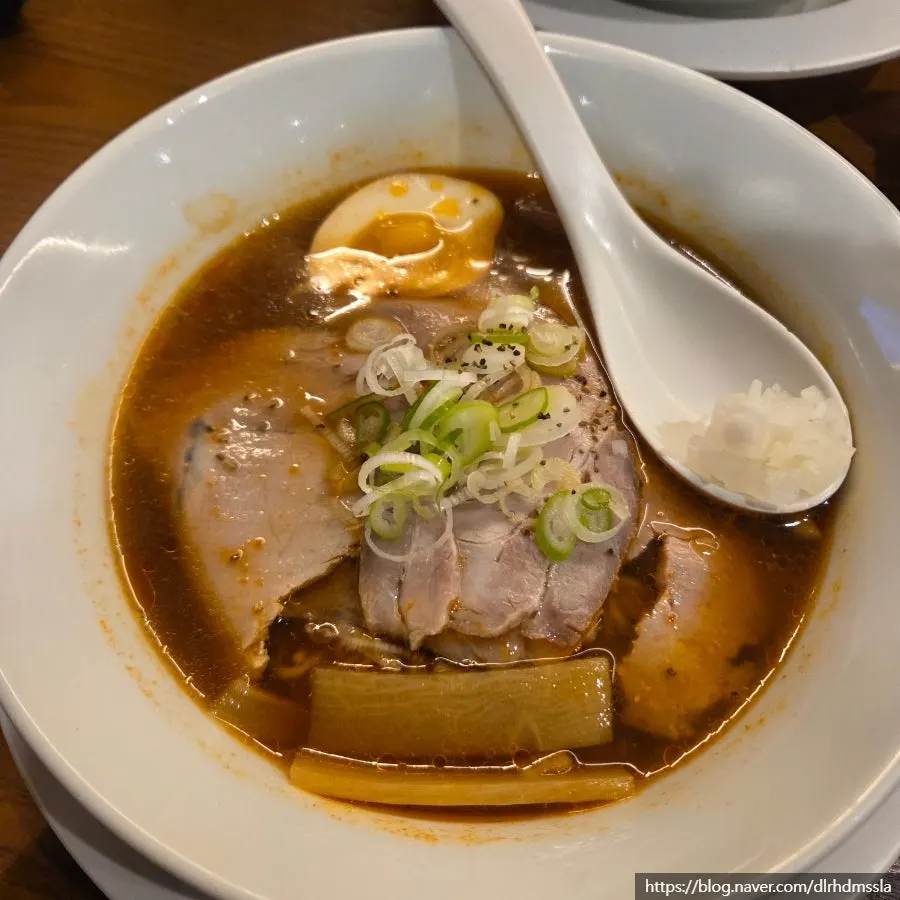 Close-up of shoyu ramen topped with chashu and menma