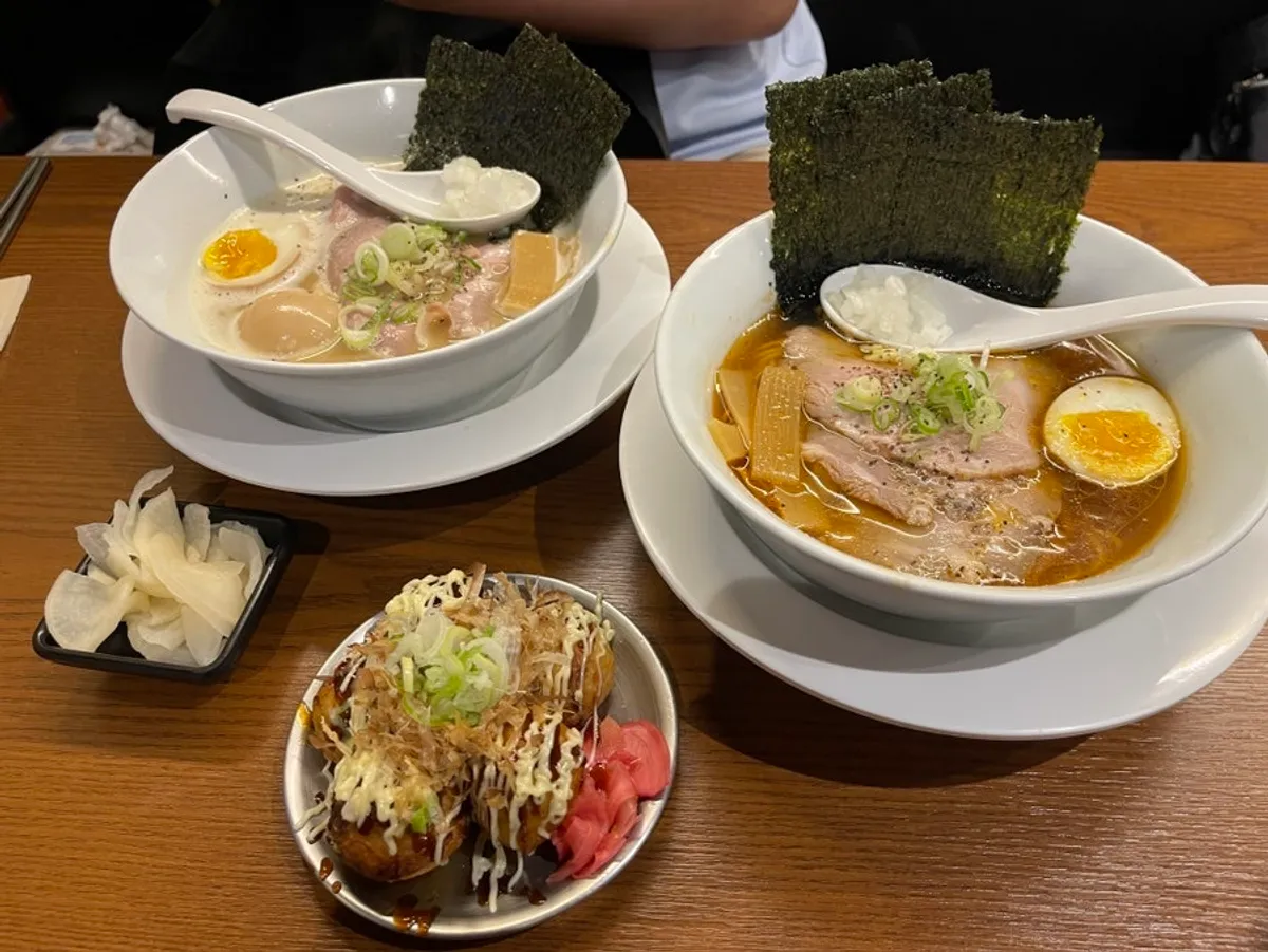 Comparing the two bowls, spicy shoyu ramen and tori paitan