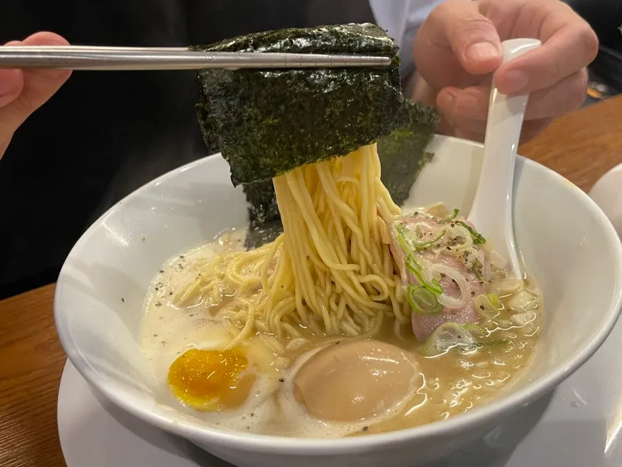 Three sheets of nori and generous onions on top of the ramen