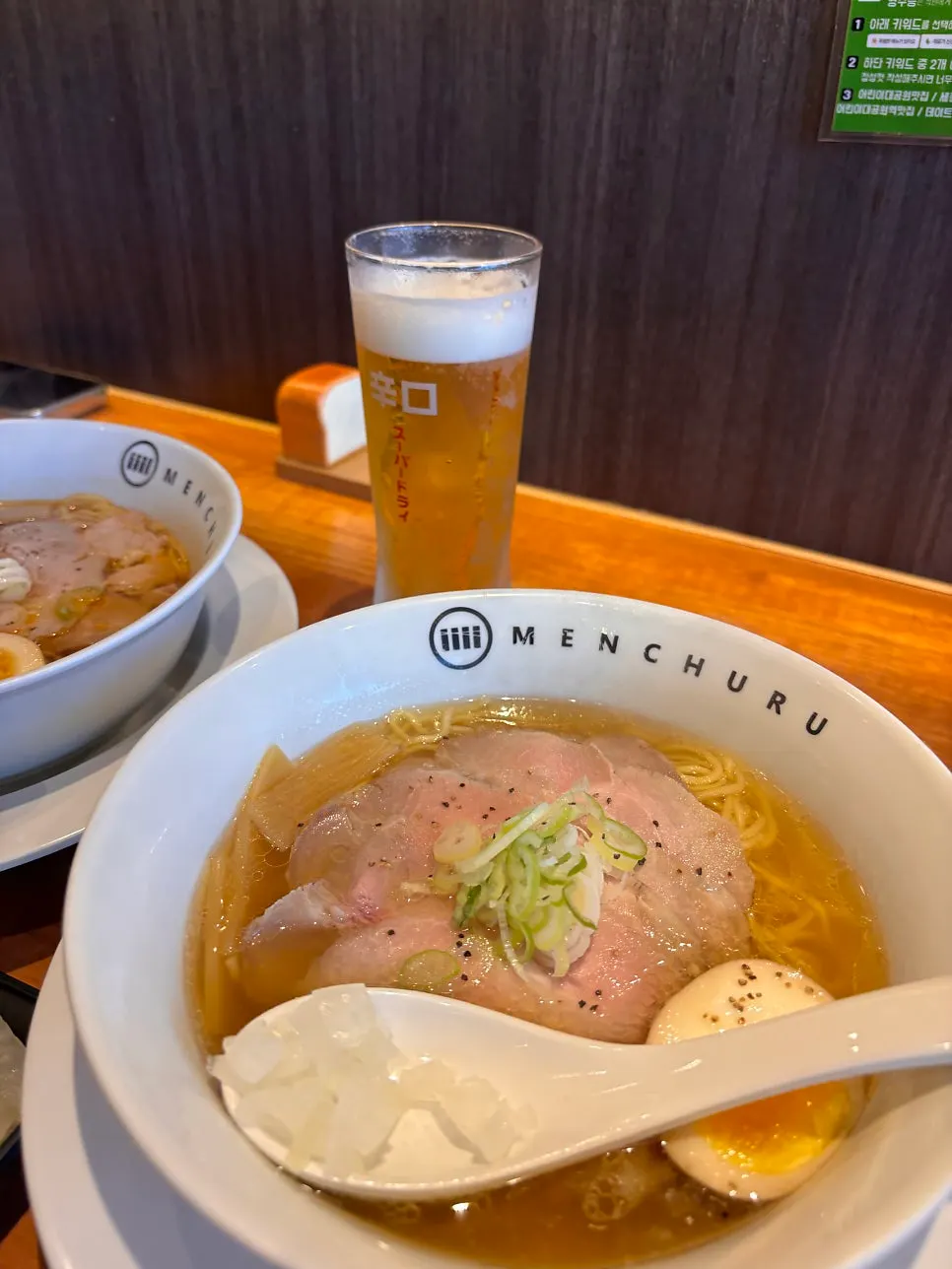 Close-up of spicy shoyu ramen toppings and broth