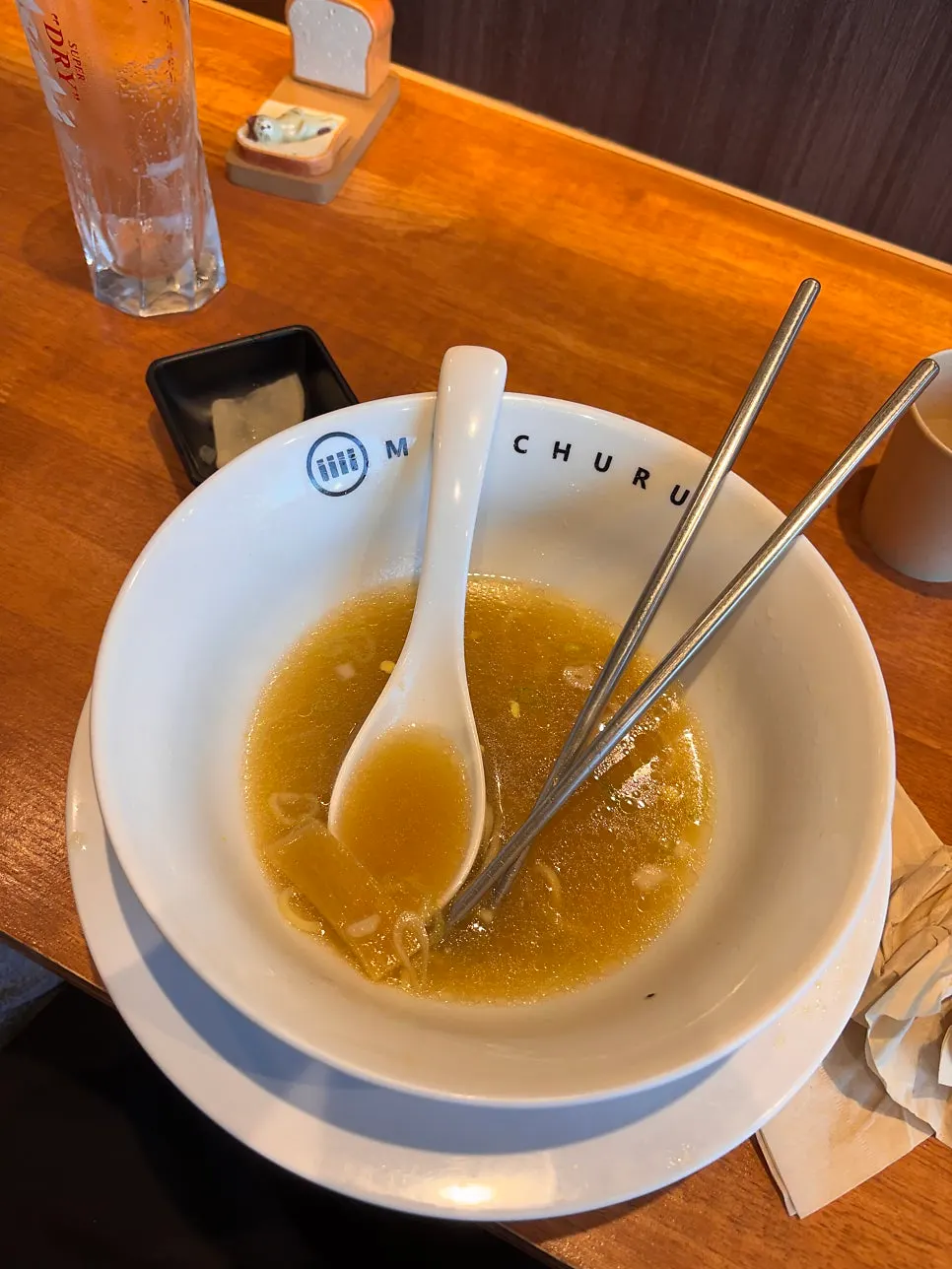An empty bowl of Mentsuru ramen, broth and all