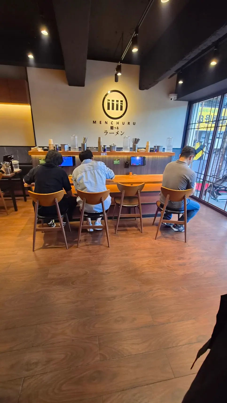 Interior of Mentsuru with a Japanese ramen shop feel