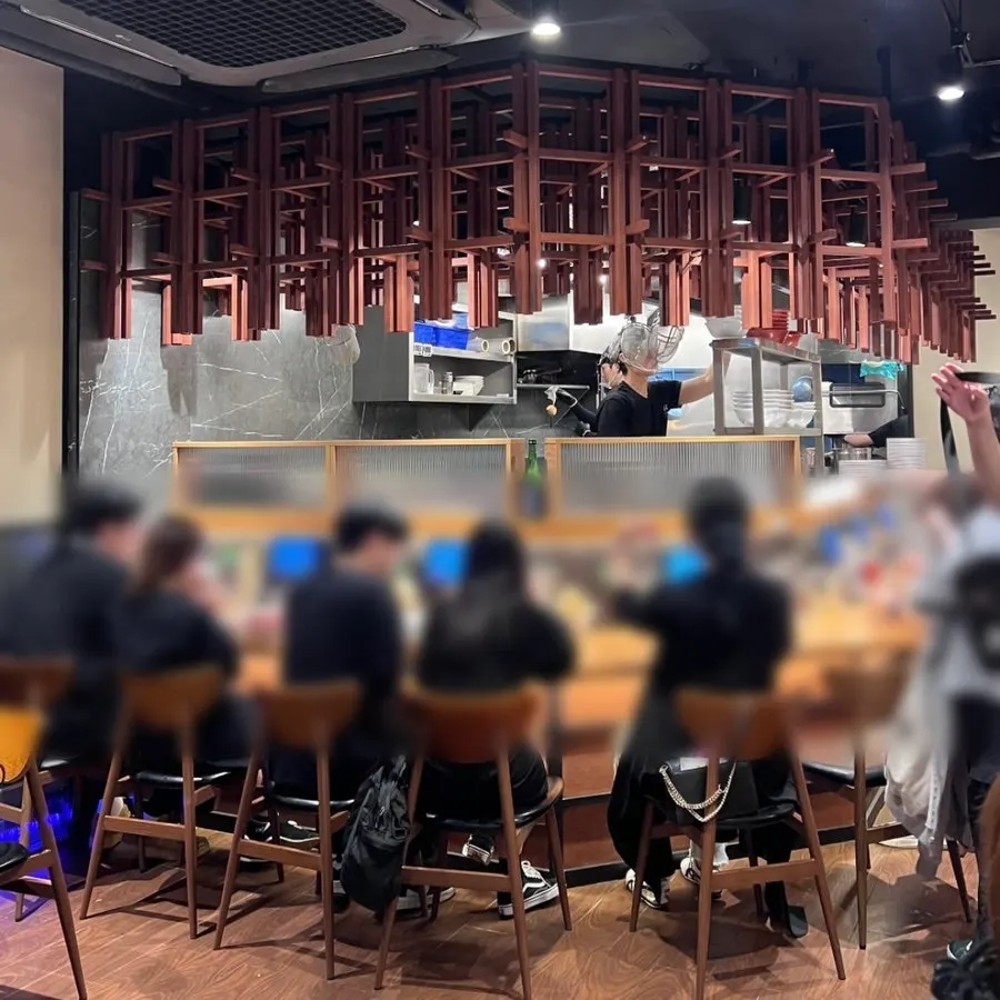 Interior of Mentsuru with bar table and 4-person seating