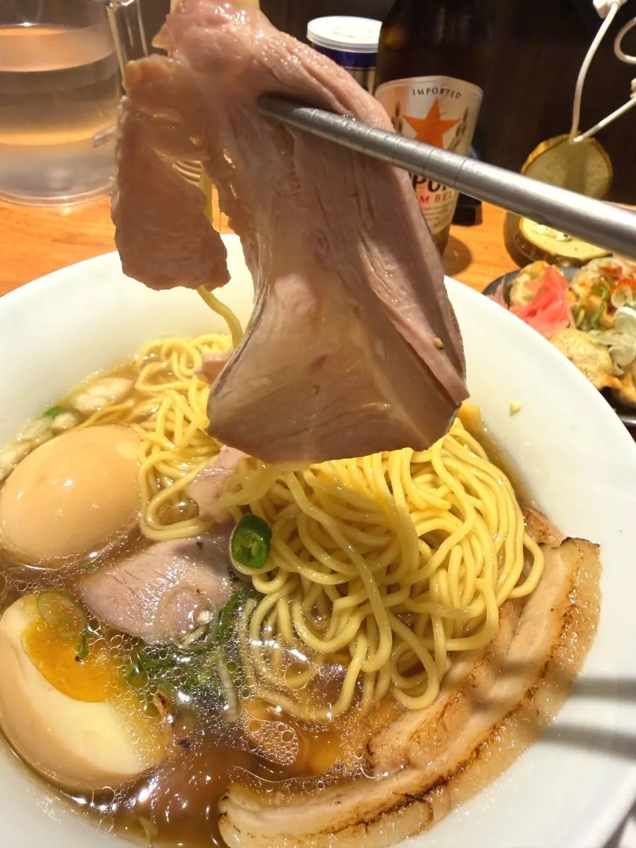 Close-up of shoyu ramen noodles and broth