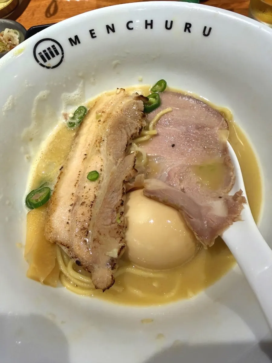 Close-up of tori paitan noodles and soft-boiled egg