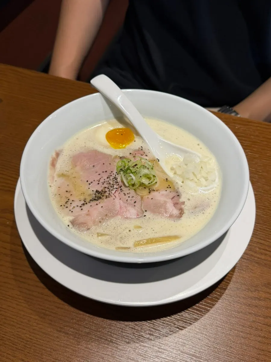 Tori paitan topped with egg and meat