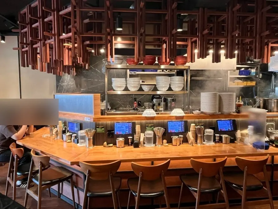 Bar seating at Mentsuru facing the open kitchen