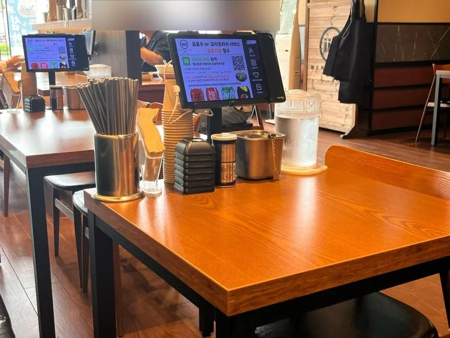 Open kitchen where the ramen-making process is visible