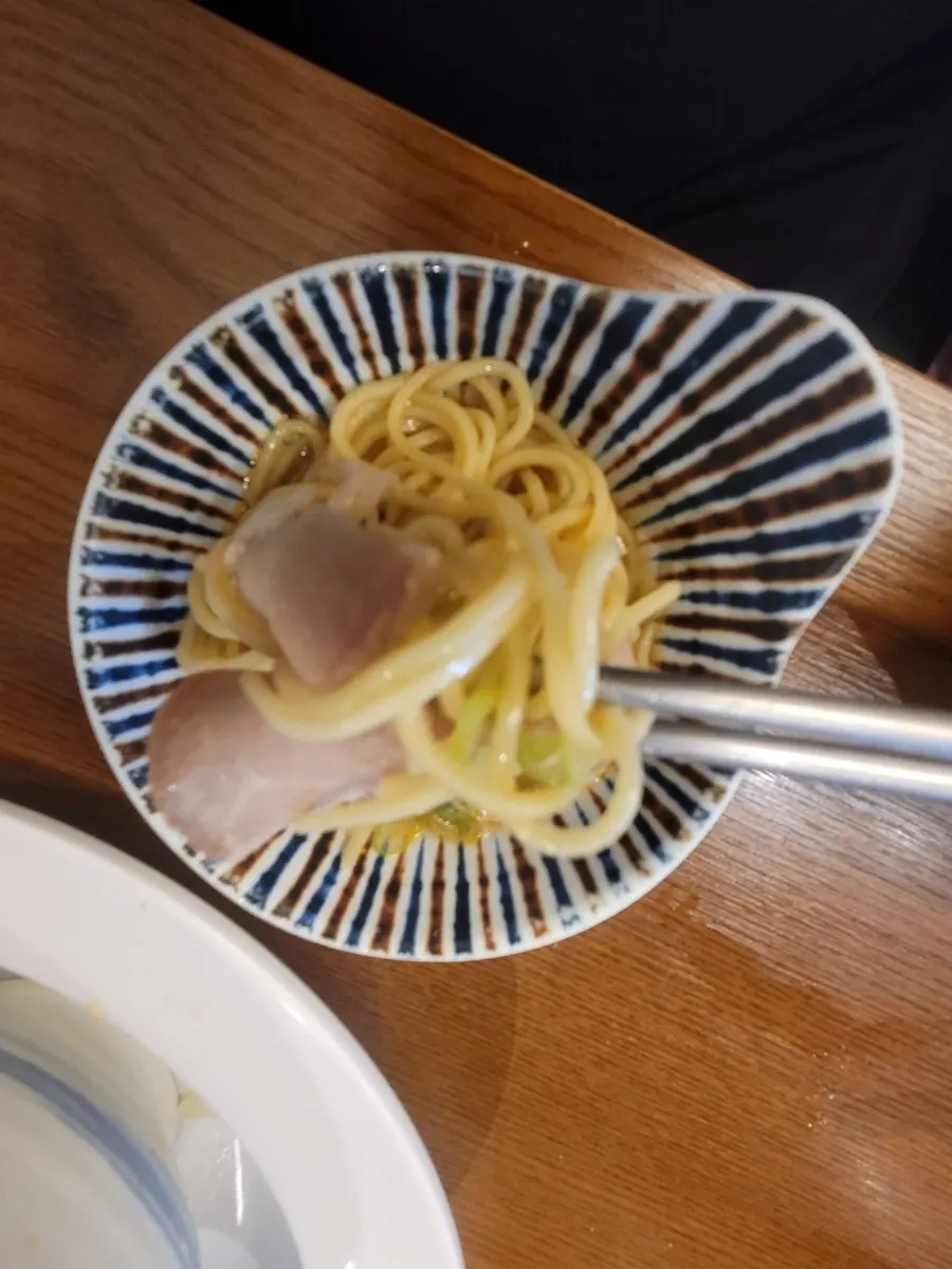 Spicy shoyu ramen topped with meat and egg