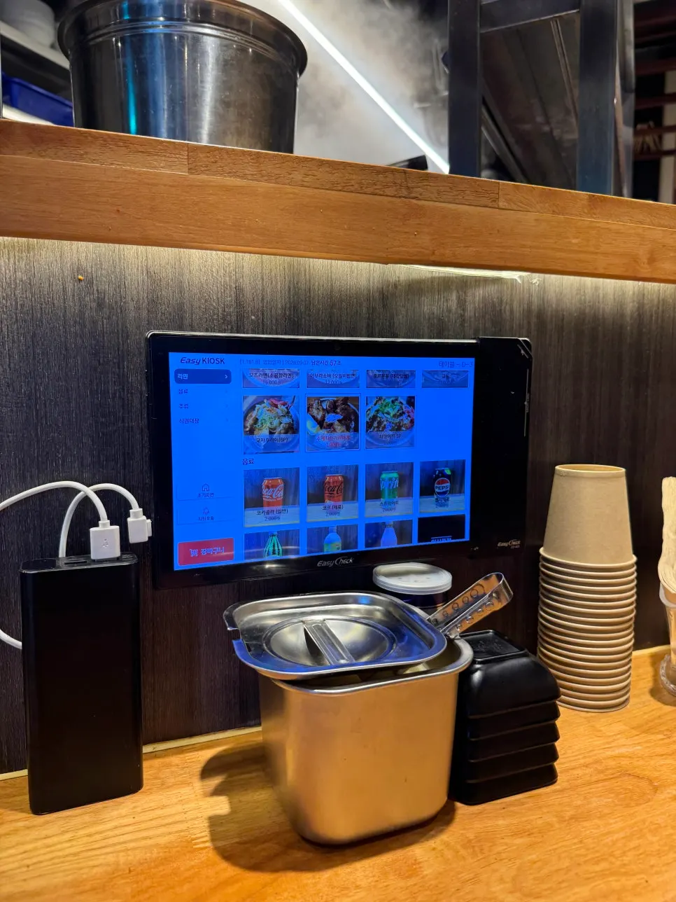 Ramen shop interior showing the open kitchen