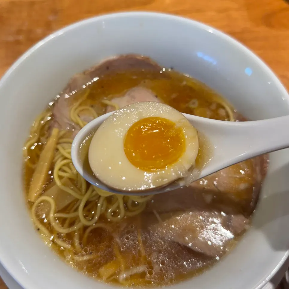 Soft-boiled egg topping cut in half