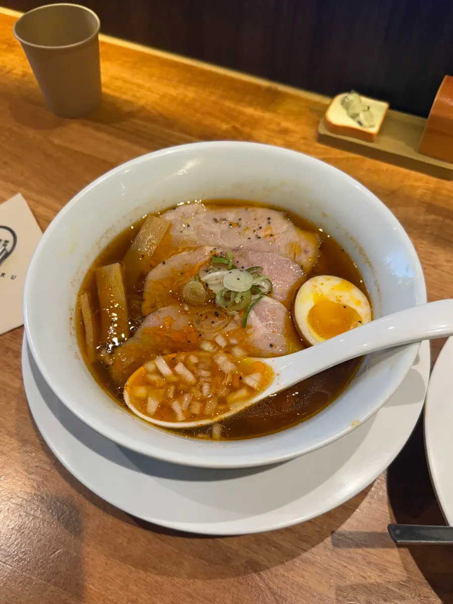 Spicy shoyu ramen topped with chashu and soft-boiled egg