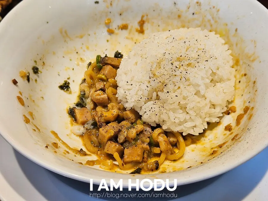 Lifting up a bite of abura soba noodles