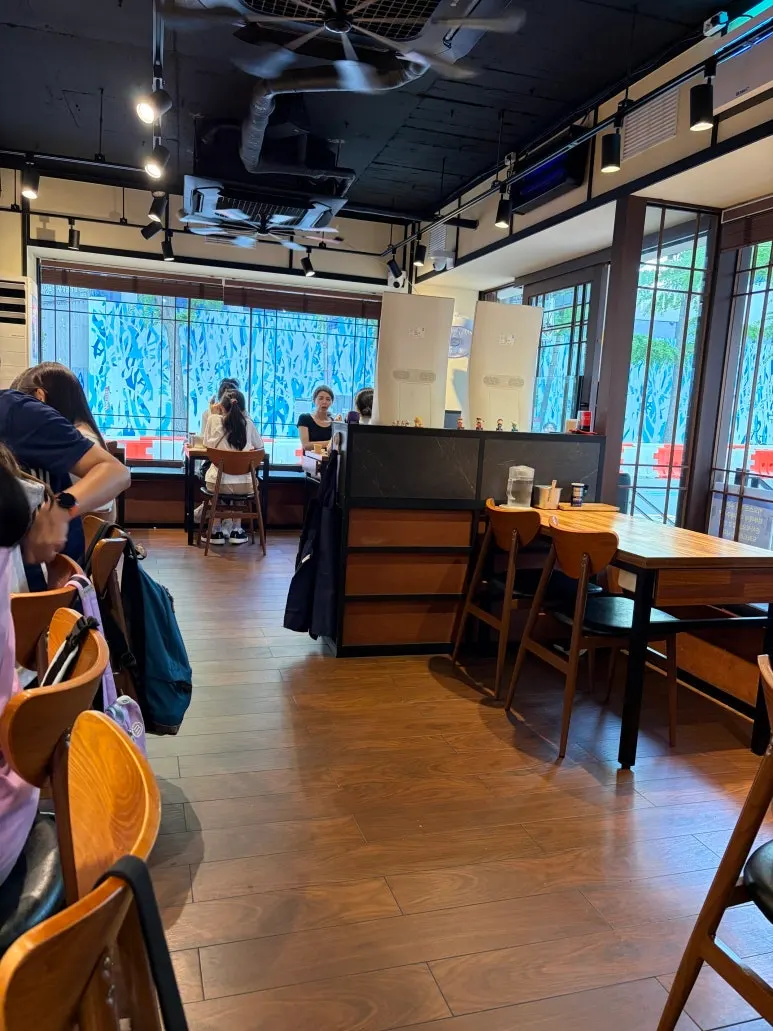 Interior of Mentsuru City Hall Branch with wood-toned decor