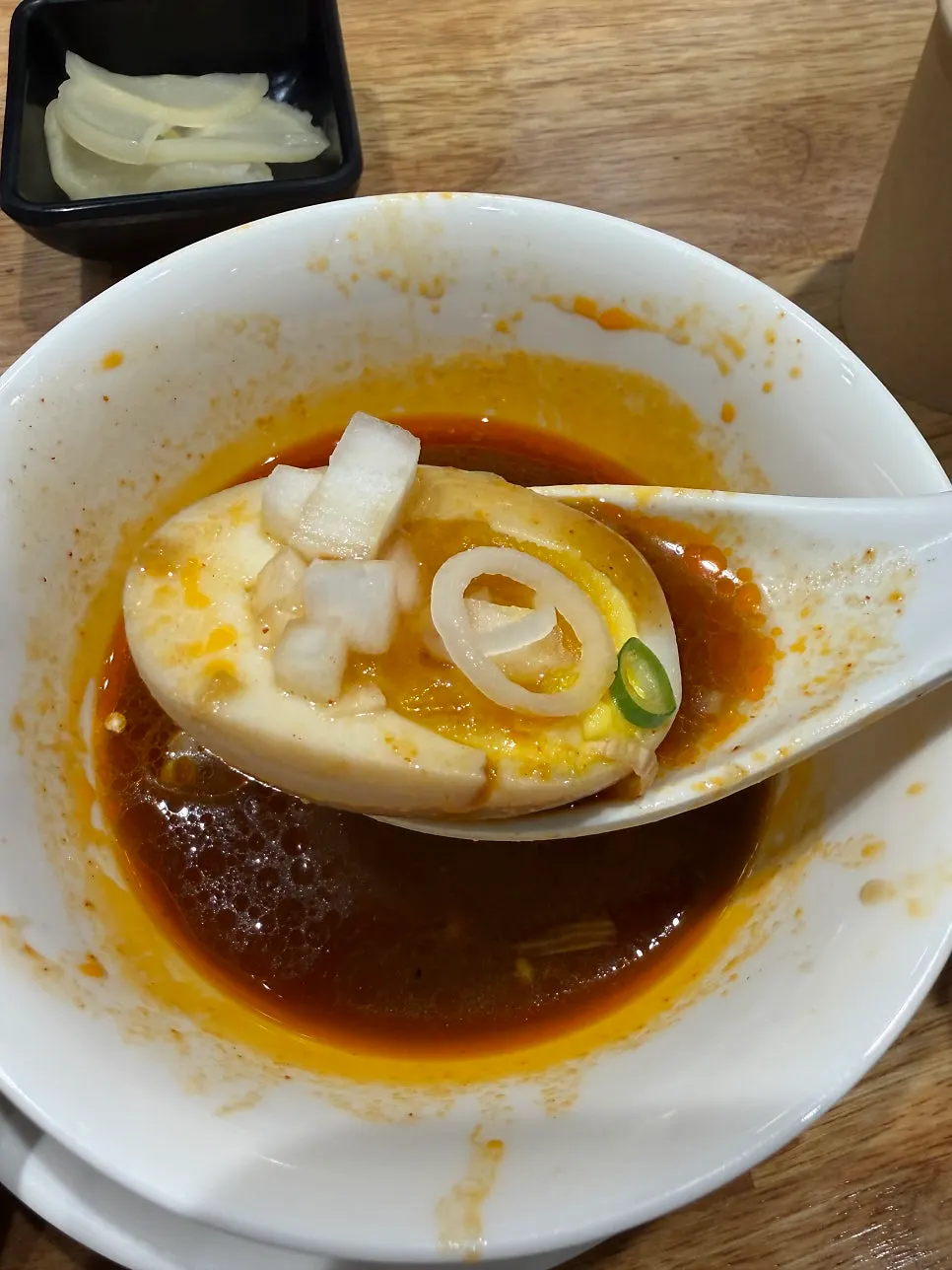 Eating tsukemen noodles wrapped in seaweed