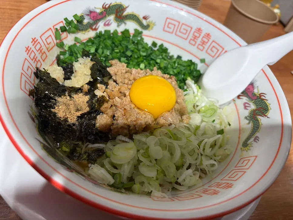 Mazesoba served in a dragon-patterned bowl