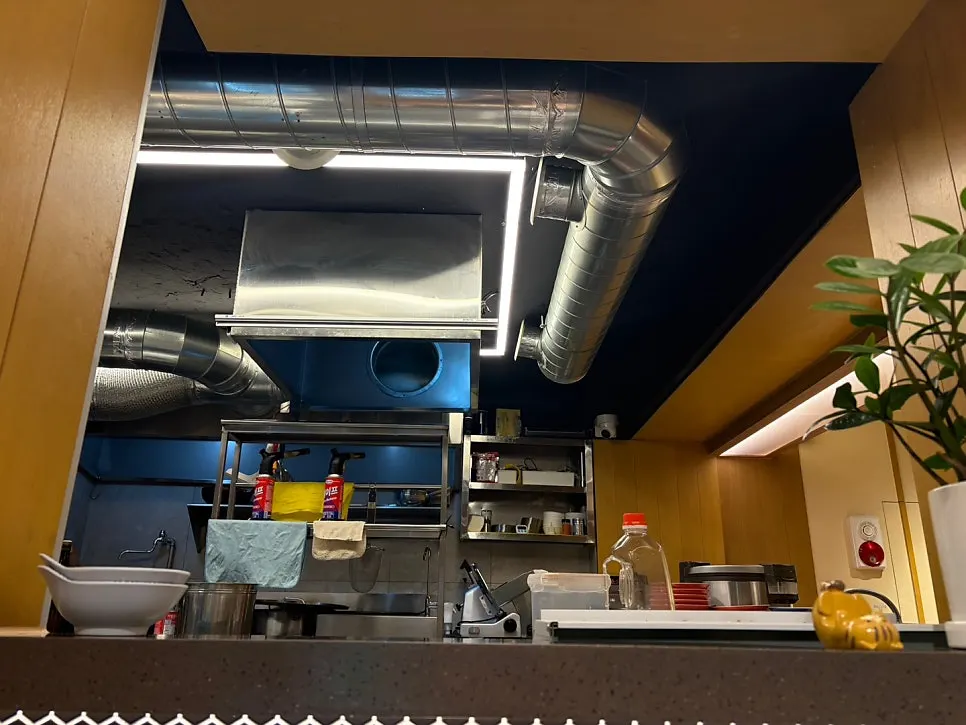 View of the open kitchen from the counter bar table
