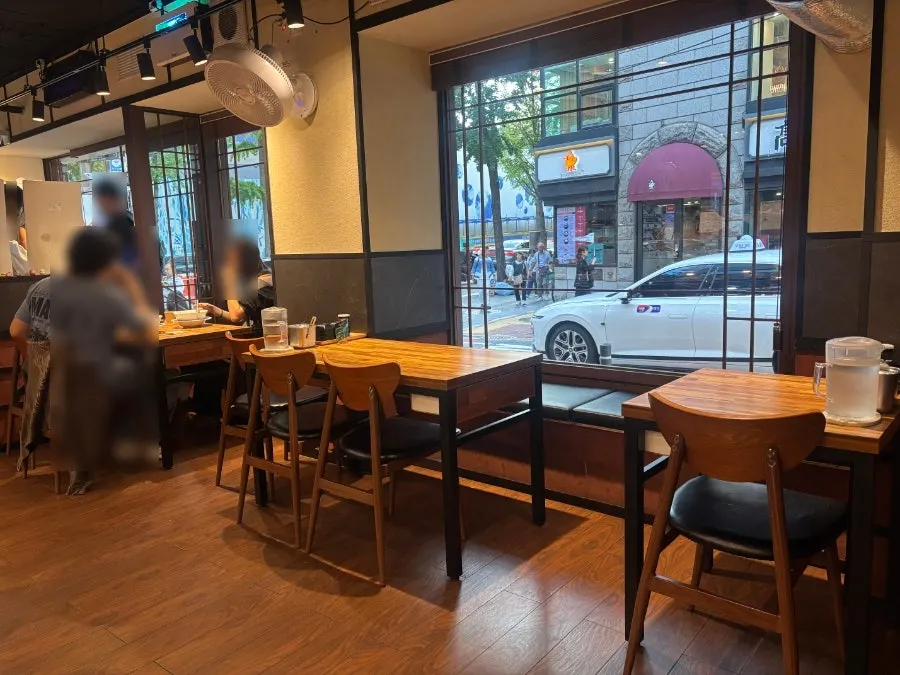 Interior of Mentsuru City Hall Branch with wood-tone decor