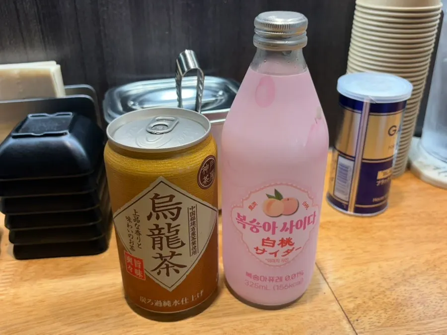 Table with self-serve ice water and pickled radish