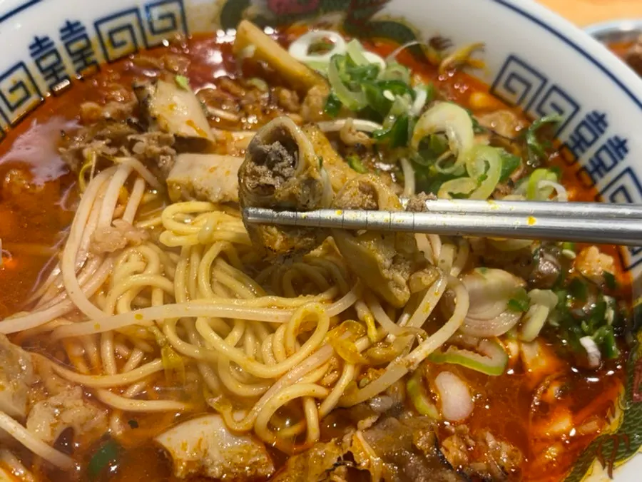 Beef tripe piled on top of noodles in motsu ramen