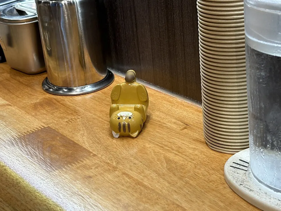 Bar seat with a phone stand for solo diners
