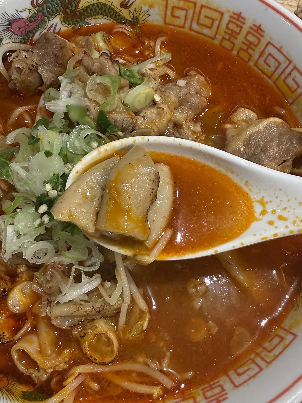 Spicy motsu ramen broth topped with beef tripe