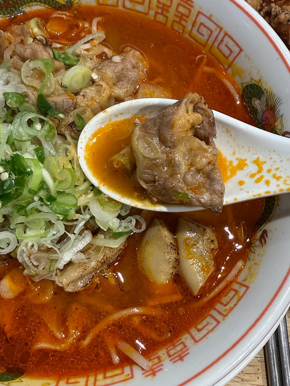 Generous beef brisket and tripe toppings in the motsu ramen