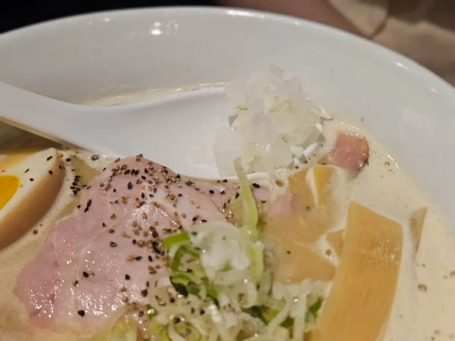 Ramen topped with a soft-boiled egg and meat