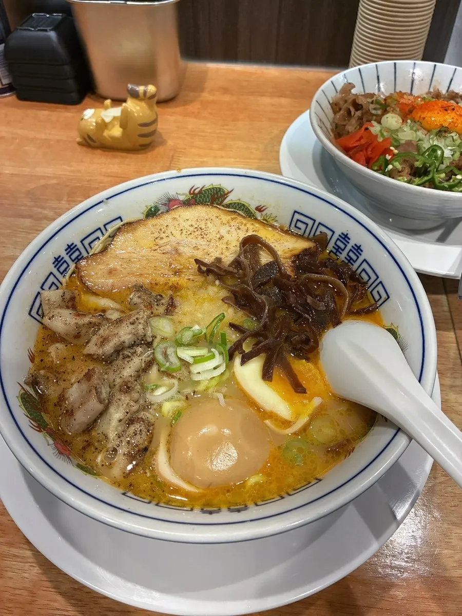 A bowl of motsu tonkotsu ramen topped with beef tripe