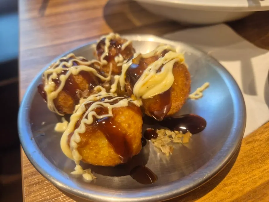 A plate of gyoza dumplings ordered as a side