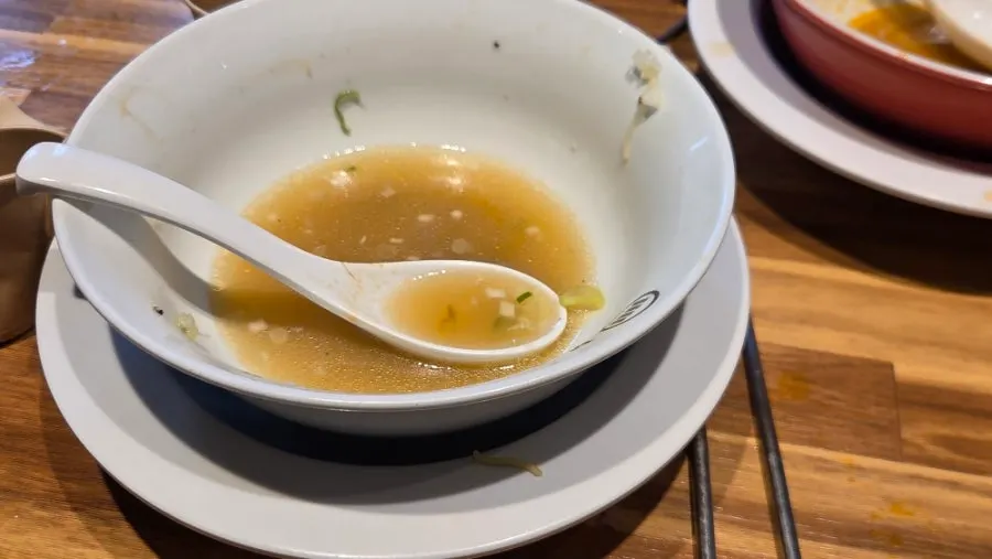Table setting with ramen served alongside rice