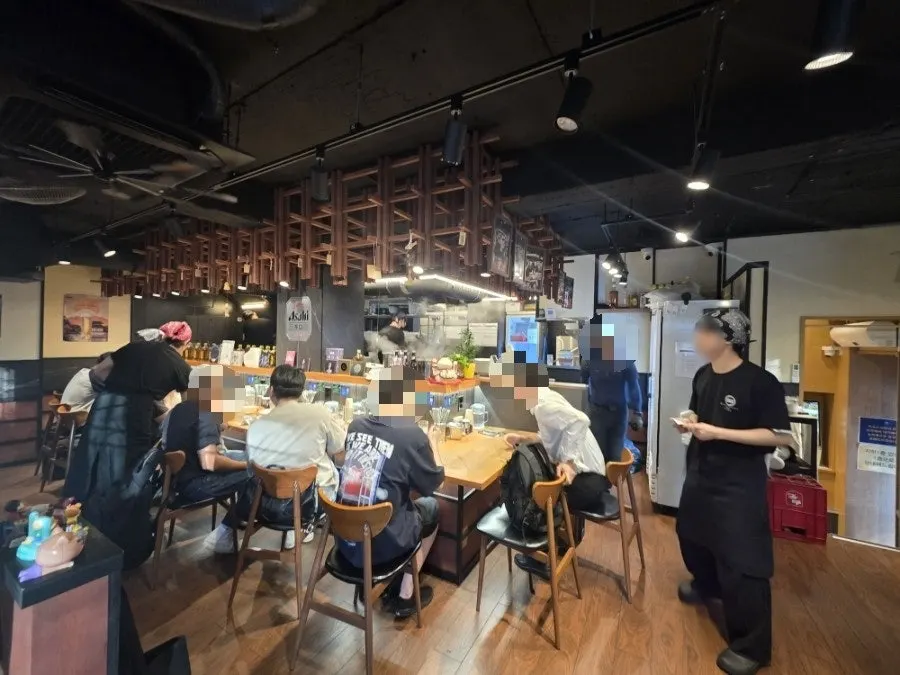 Interior of Mentsuru City Hall Branch with customers continuously coming in