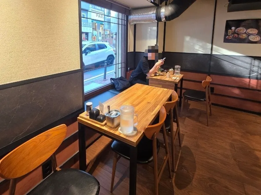 1st floor seating with wood-tone interior