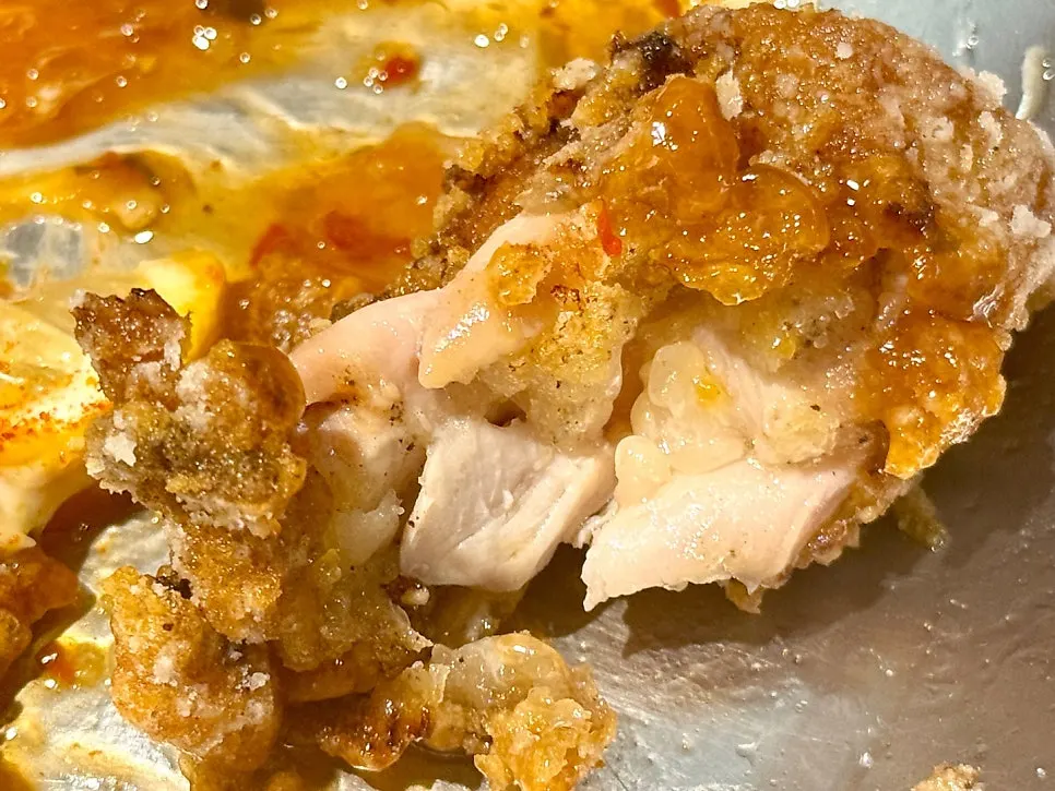 Large piece of karaage dipped in mayo sauce