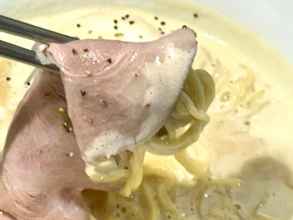 Close-up of tori paitan ramen toppings and broth