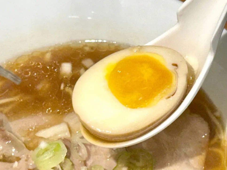 Close-up of soyu ramen chashu and soft-boiled egg
