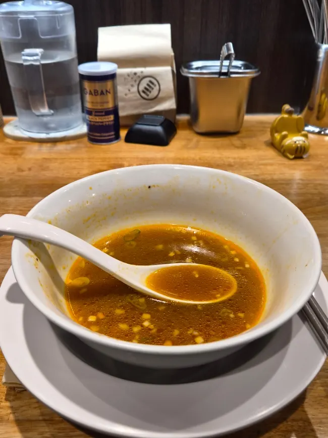 Peach cider enjoyed alongside the spicy soy ramen