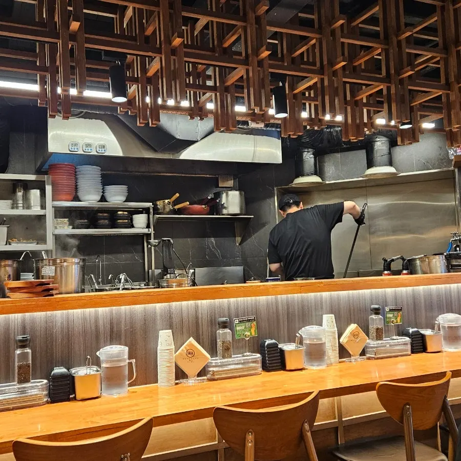 Interior with bar seats facing the kitchen