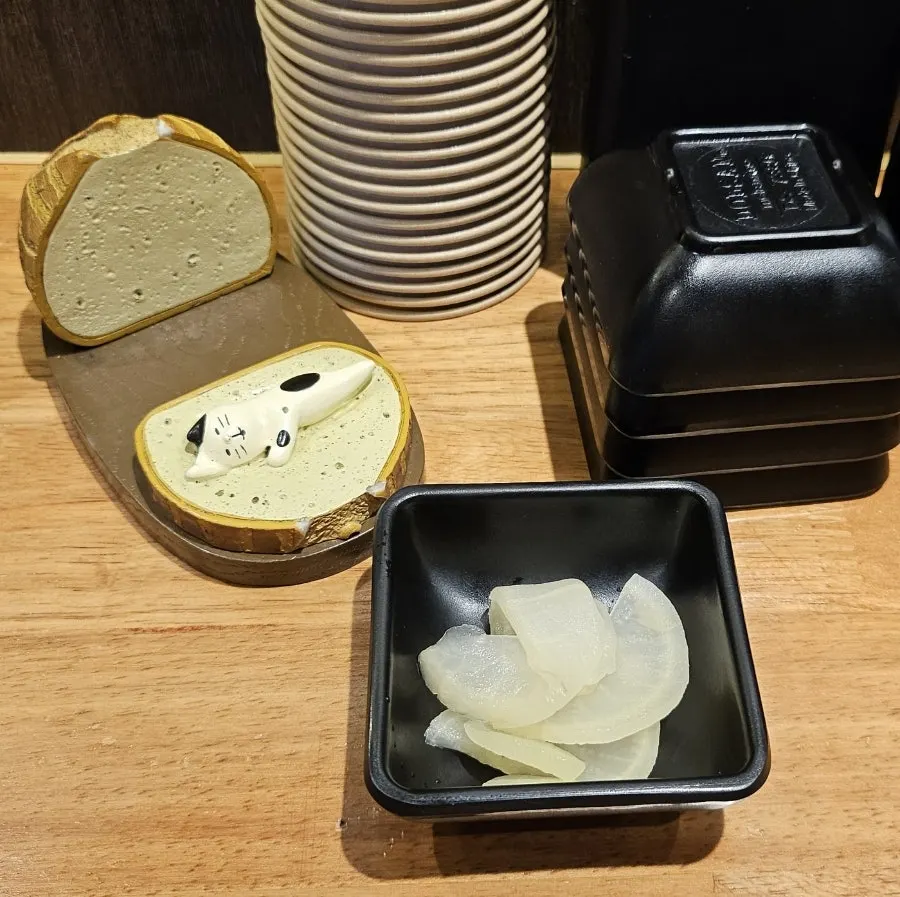 Motsu ramen on the table with side dishes
