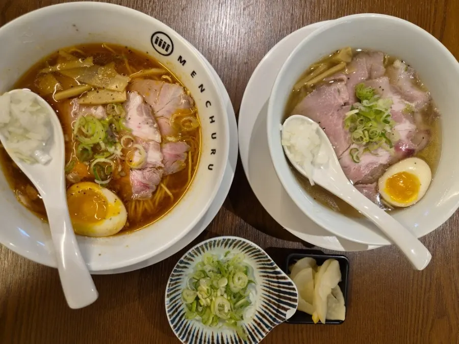 Table with the ordered spicy shoyu ramen and shio ramen