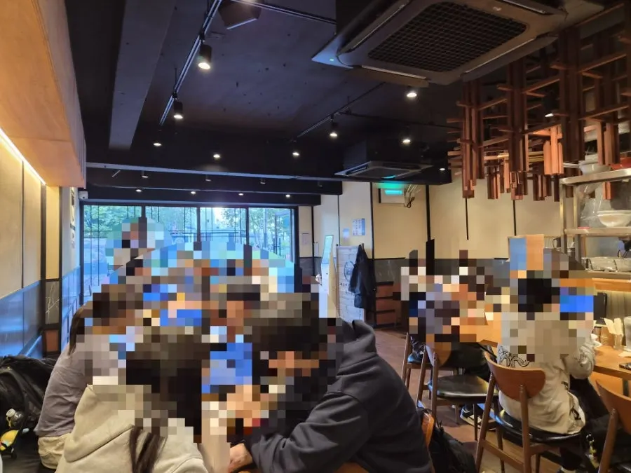 Mentsuru dining room full of customers at 6pm
