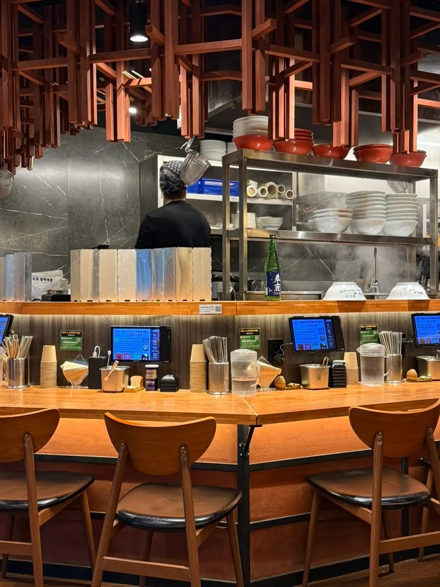 Interior seating of the black-tone ramen restaurant