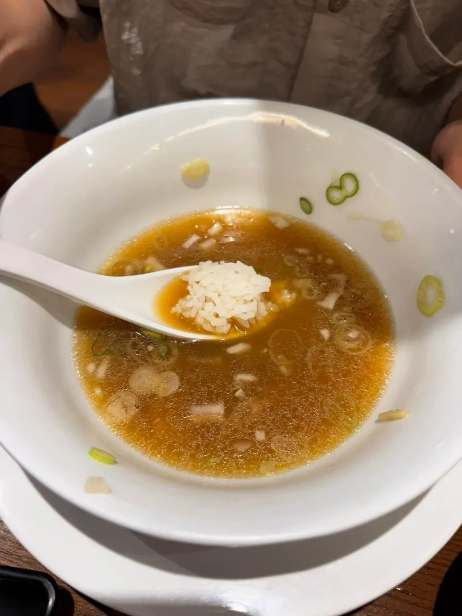 A shoyu ramen bowl with almost no soup left