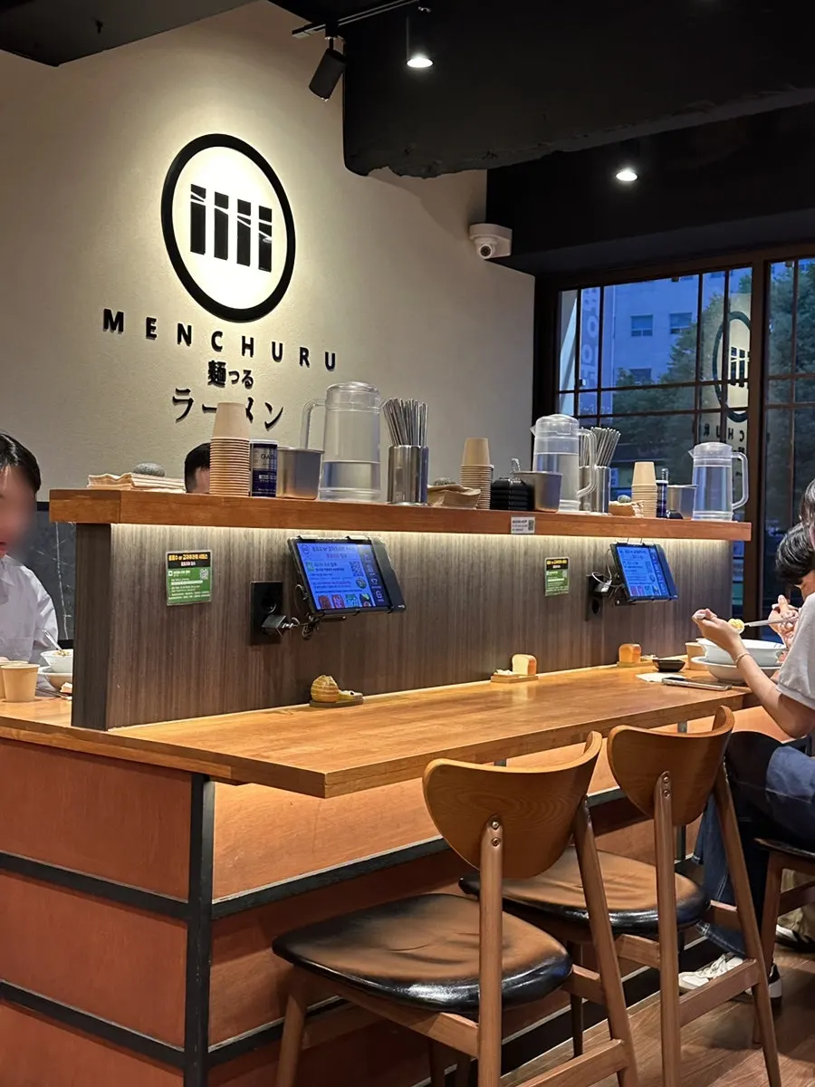Interior of Mentsuru with bar seats and table seating